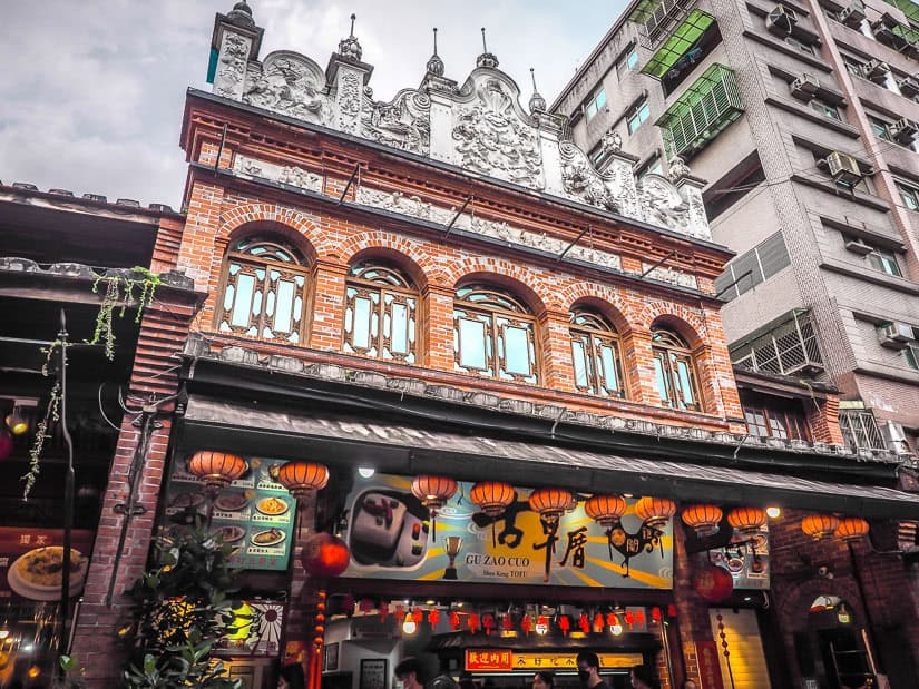 A stinky tofu restaurant at the bottom of a historic red brick building on Shenkeng Old Street