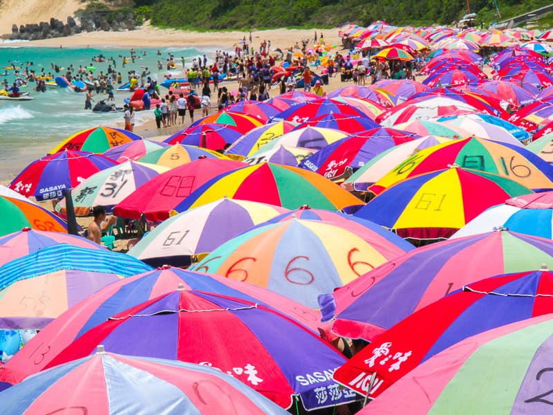 A sea of colorful umbrellas on a beach Kenting
