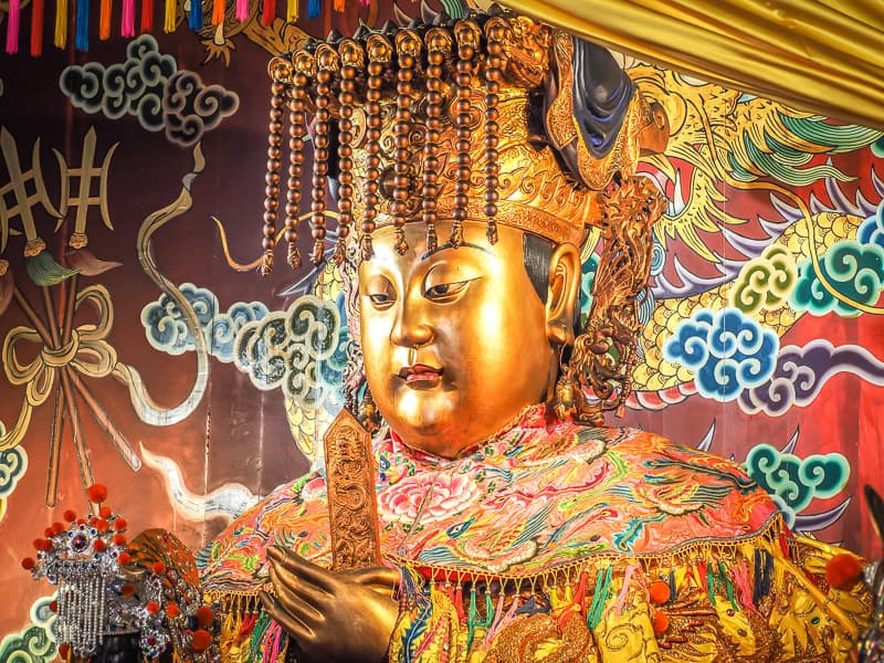 An ornate golden statue of Matsu, goddess of fishermen and the sea