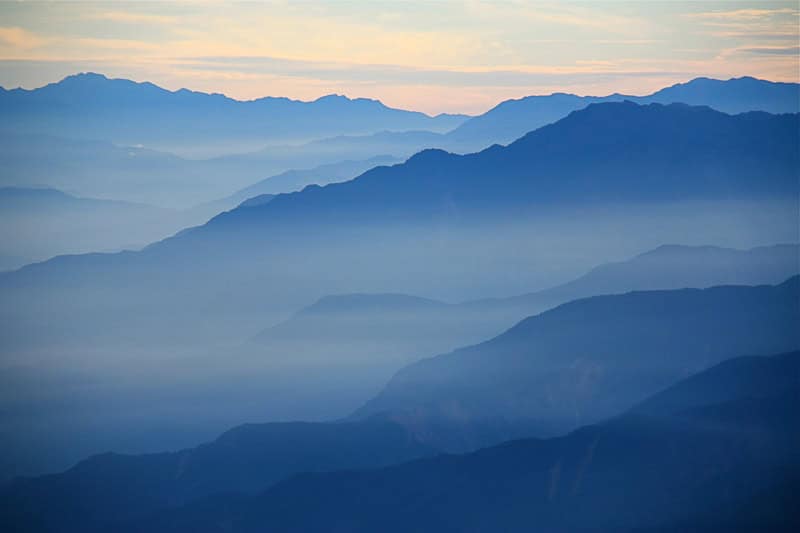 Some misty mountain peaks in Yushan National Park at sunrise time