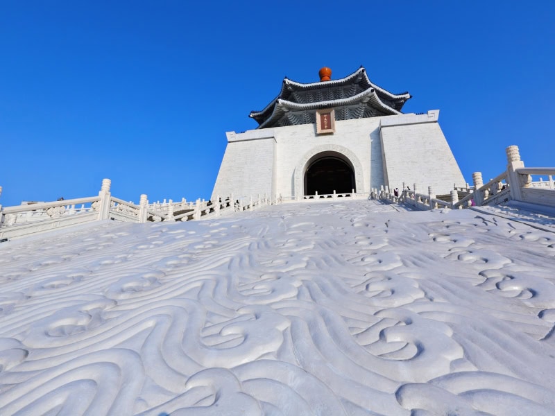 Looking up some carved white reliefs in between the staircases leading up to the Chiang Kai Shek Memorial Hall building