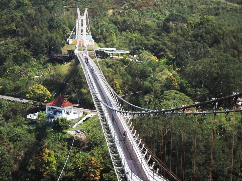 Looking down on Taiping Suspension bridge, with the verdant valley floor below