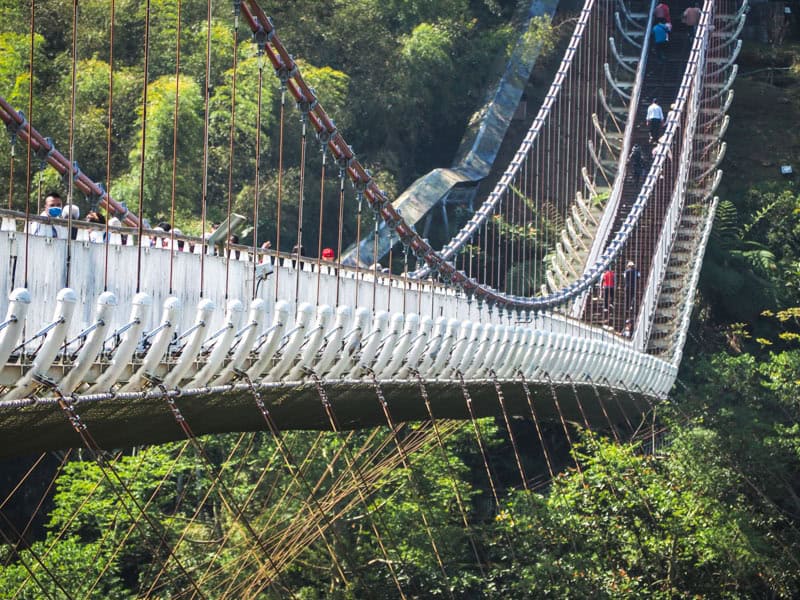 Close up of the end of Taiping Suspension Bridge as it crosses a valley then climbs up to the opposite side