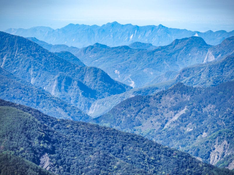 Several layers of mountains fading in the distance