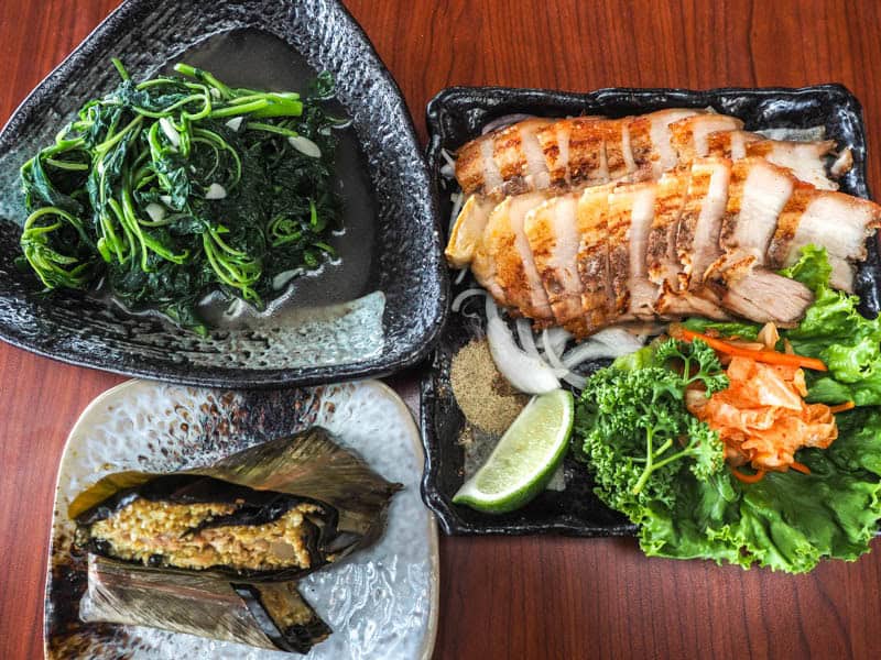 Three dishes of Taiwanese Indigenous food on a table, shot from above them