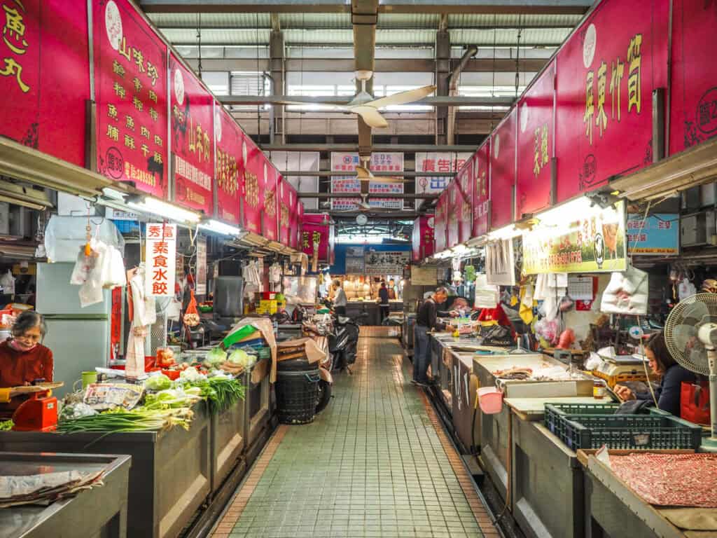Inside Sanmin wet market, looking down a row of vendors