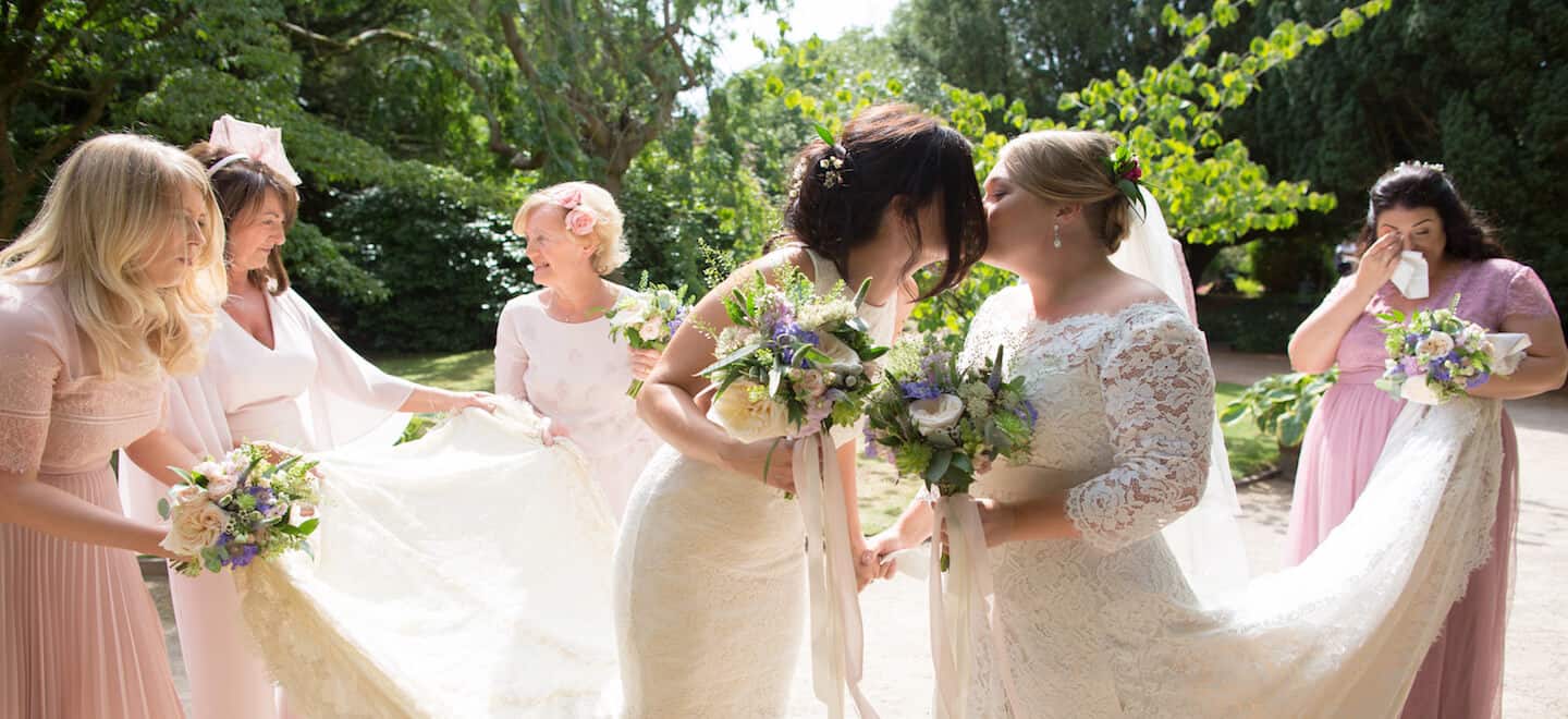 2 Wedding Party Hold Out Brides Trains By Ragdoll Photography Lesbian Staffordshire Wedding Photographer Gay Wedding Guide 6