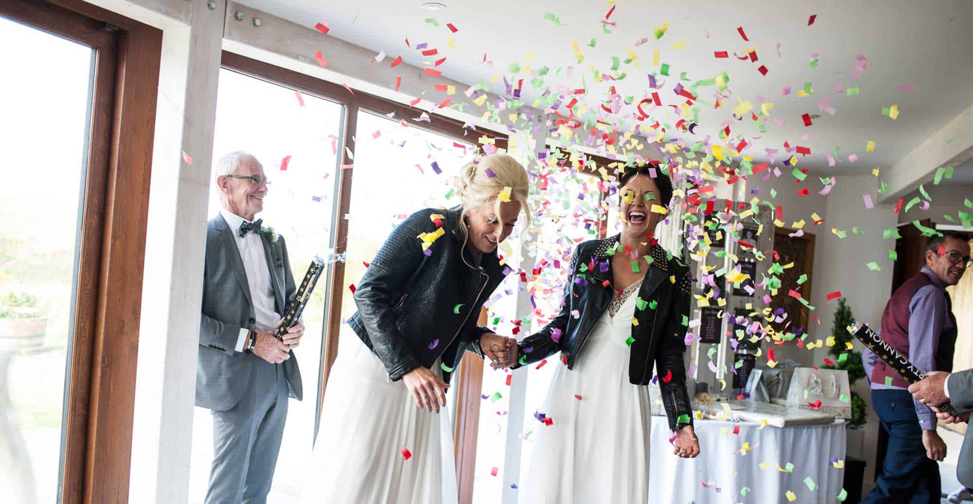 Brides Confetti At Lesbian Wedding Of Emma And Amy At Ocean Kave Image By Mrsjutsonphotography 1 5