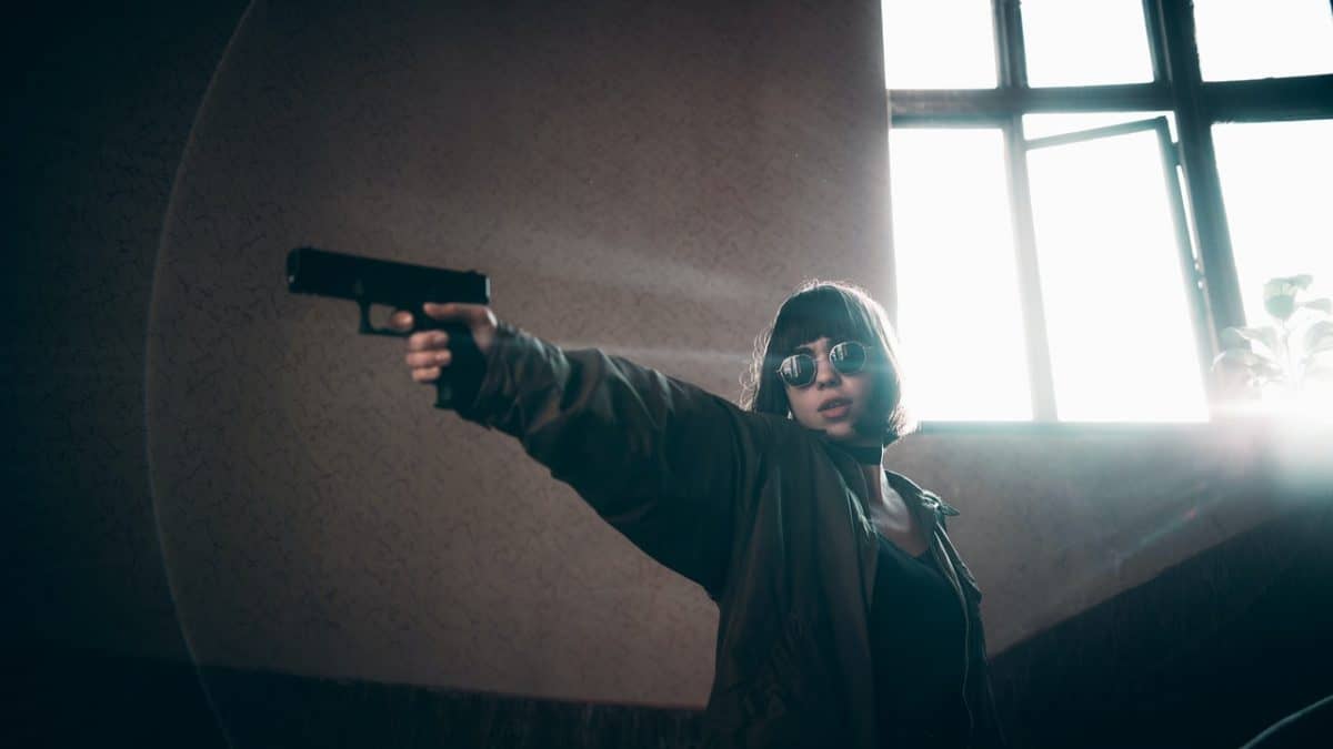 Girl Aiming Firearm.