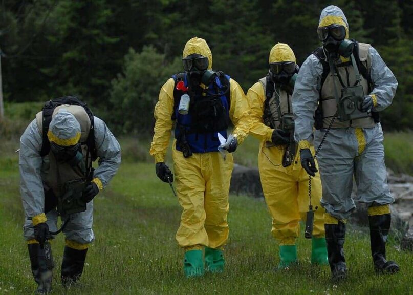 Washington: members of the fema mobile emergency response support (mers) based in bothell, washington, use a anpdr-77 radial with probe to detect radiation during a mock drill at naval air station (nas) whidbey island seaplane base during exercise island escape 2010. Mers team members provides communications support to the public by operating satellite uplink, computers, telephone and power generation at a staging area near a disaster.
