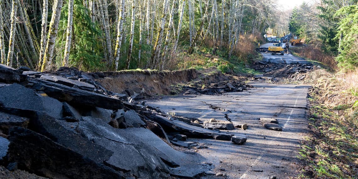 A road damaged by flooding after a storm in washington