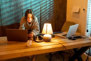 A person in a cozy sweater showcasing chic home office decor.