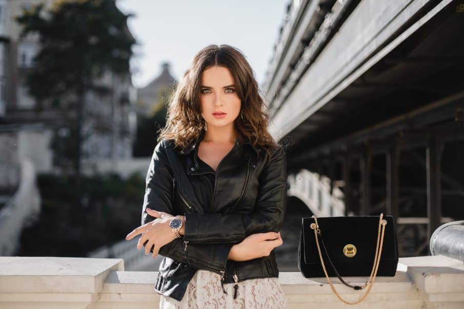 Outdoor women’s photoshoot in warsaw — confident portrait in a leather jacket and skirt, highlighting a stylish urban mood