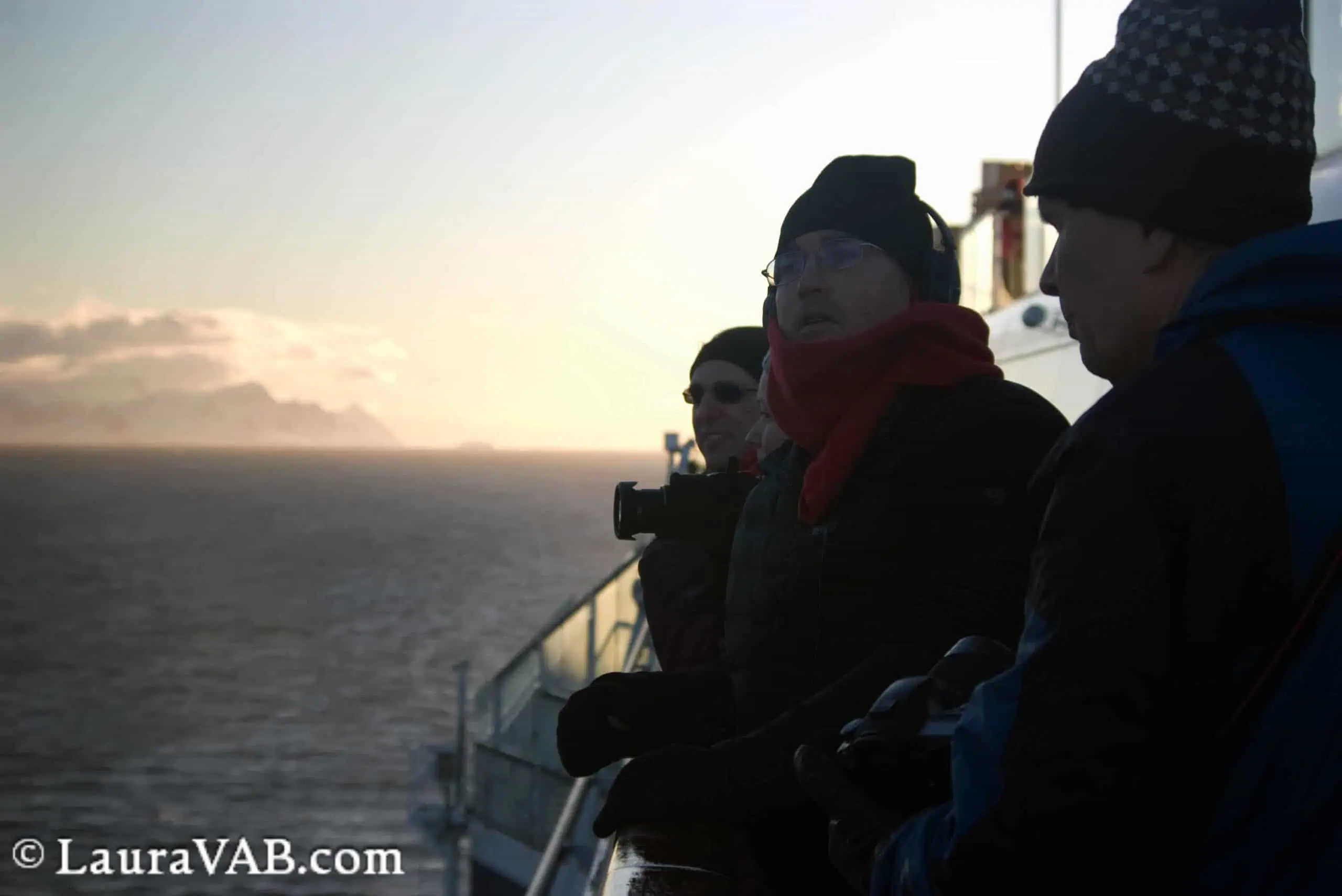 happy travelers observing in the late light