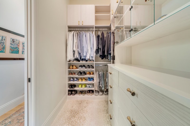beautiful chic closet space in sarasota with shoe cubbies, shelves, drawers