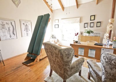 A room with chairs and a desk.