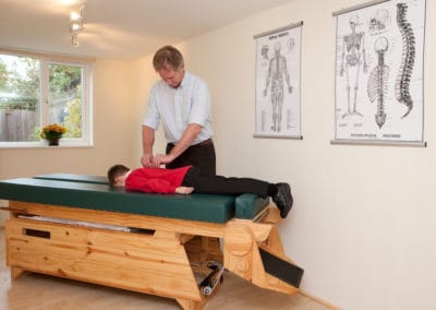 A man receiving Body Stress Release on a table.