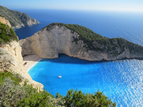 A breathtaking view of Navagio Beach with azure waters surrounded by cliffs in Greece.