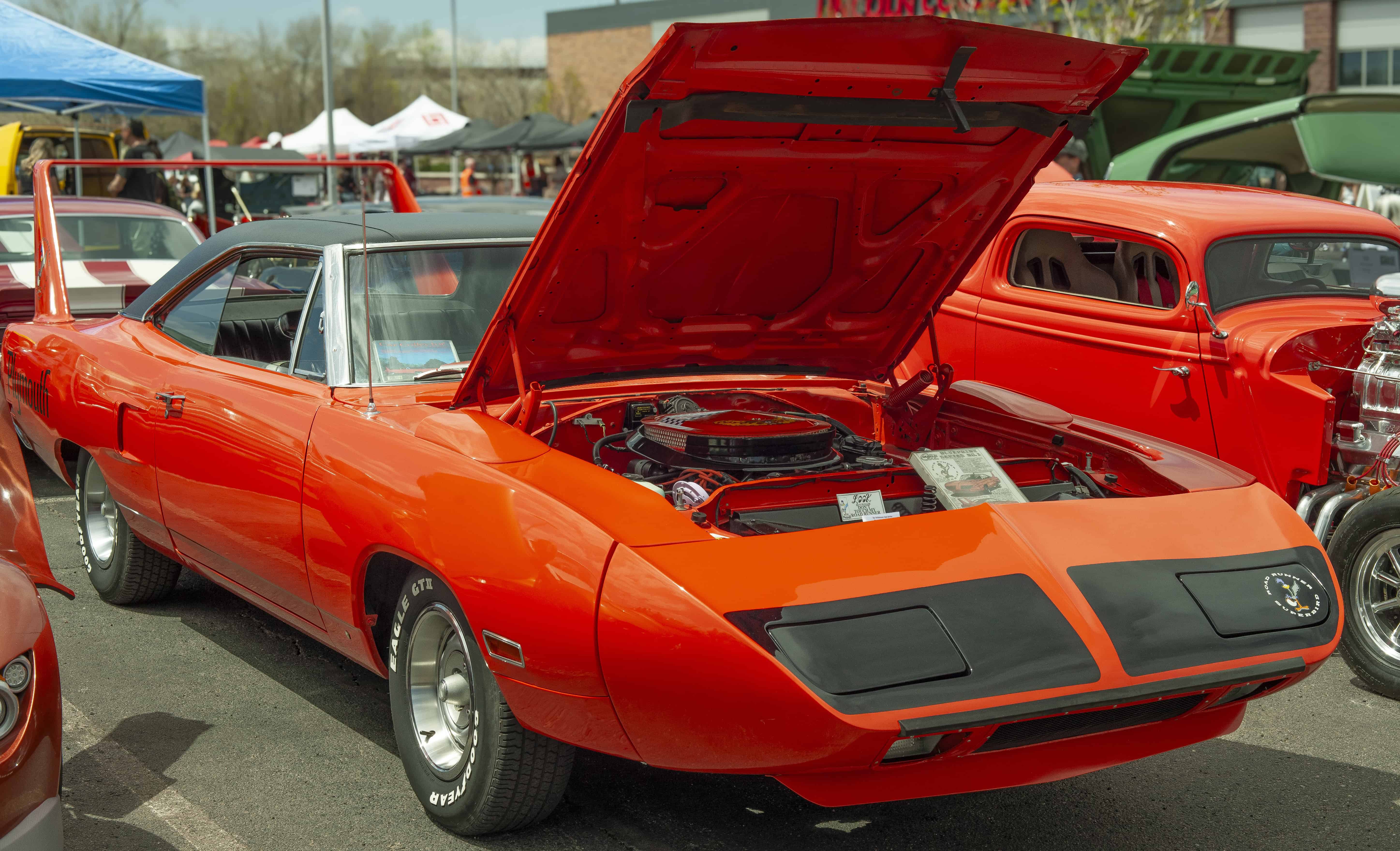 Orange 1970 Plymouth Superbird with aerodynamic nose cone and tall rear wing