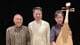 The Pacific Trio members posing with pipa on black background