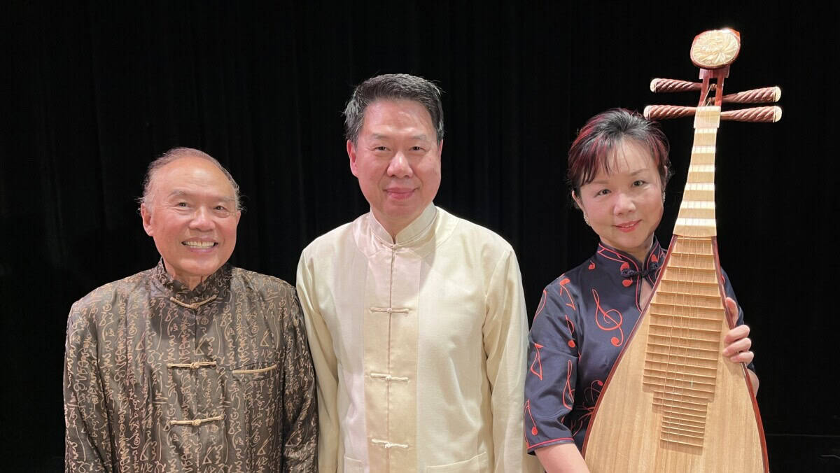 The Pacific Trio members posing with pipa on black background