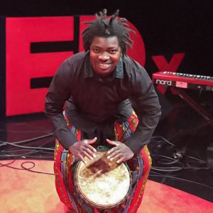 Image of Dramane on TEDx stage
