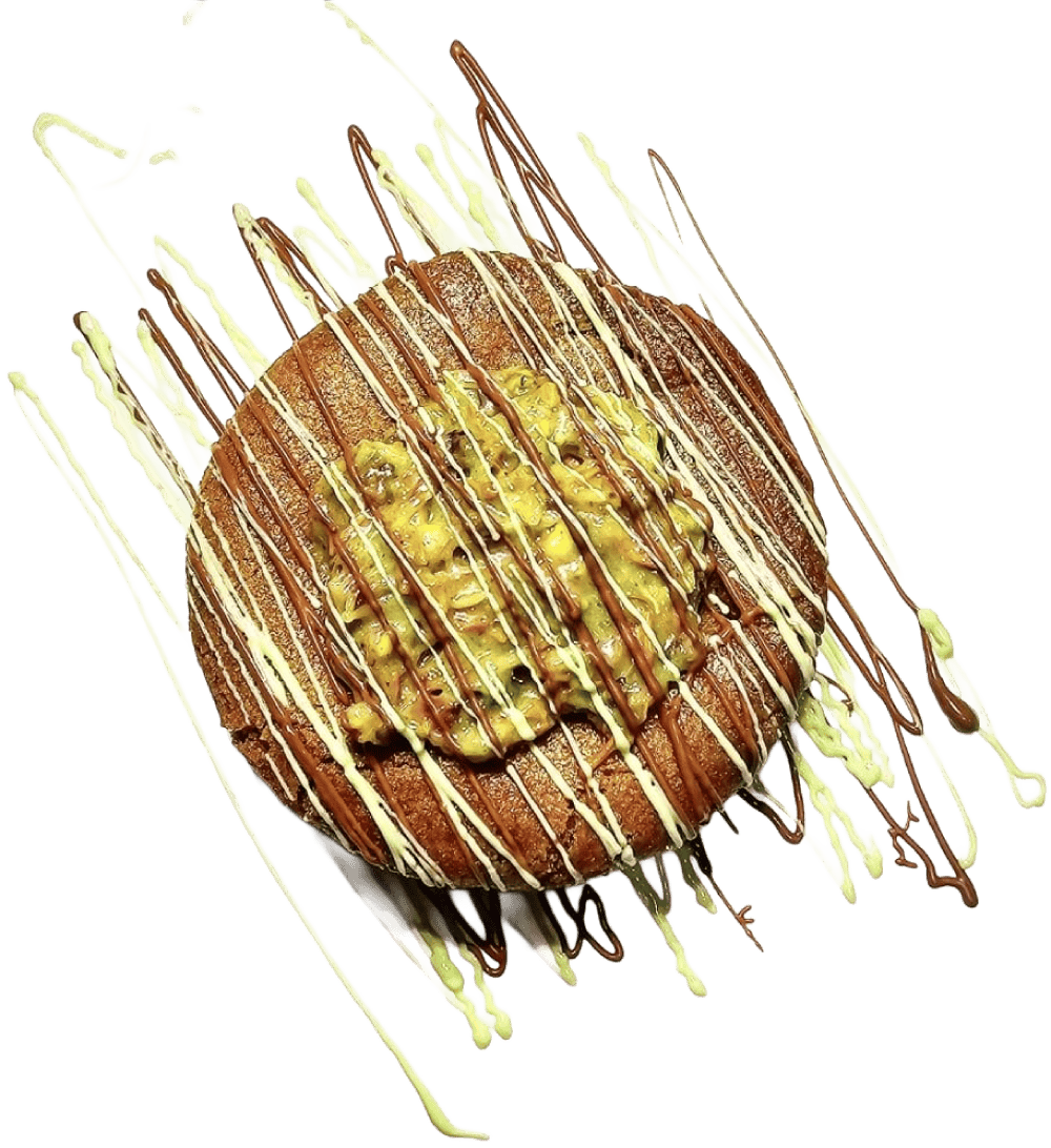large chocolate cookie with chocolate and pistachio topping with fresh crushed pistachio topping