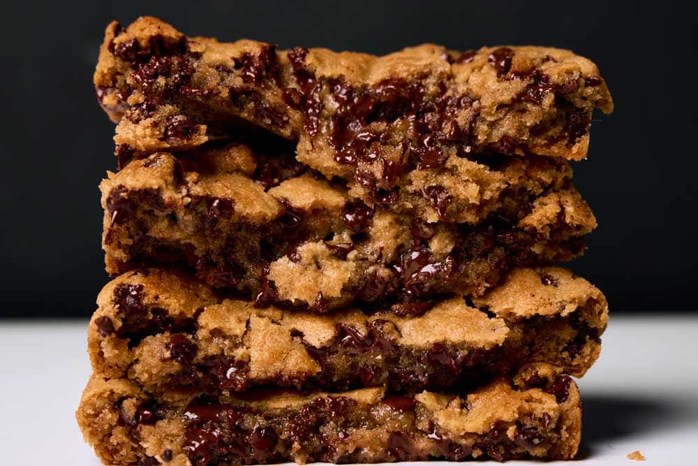 Thick stacks of gooey chocolate chip cookies