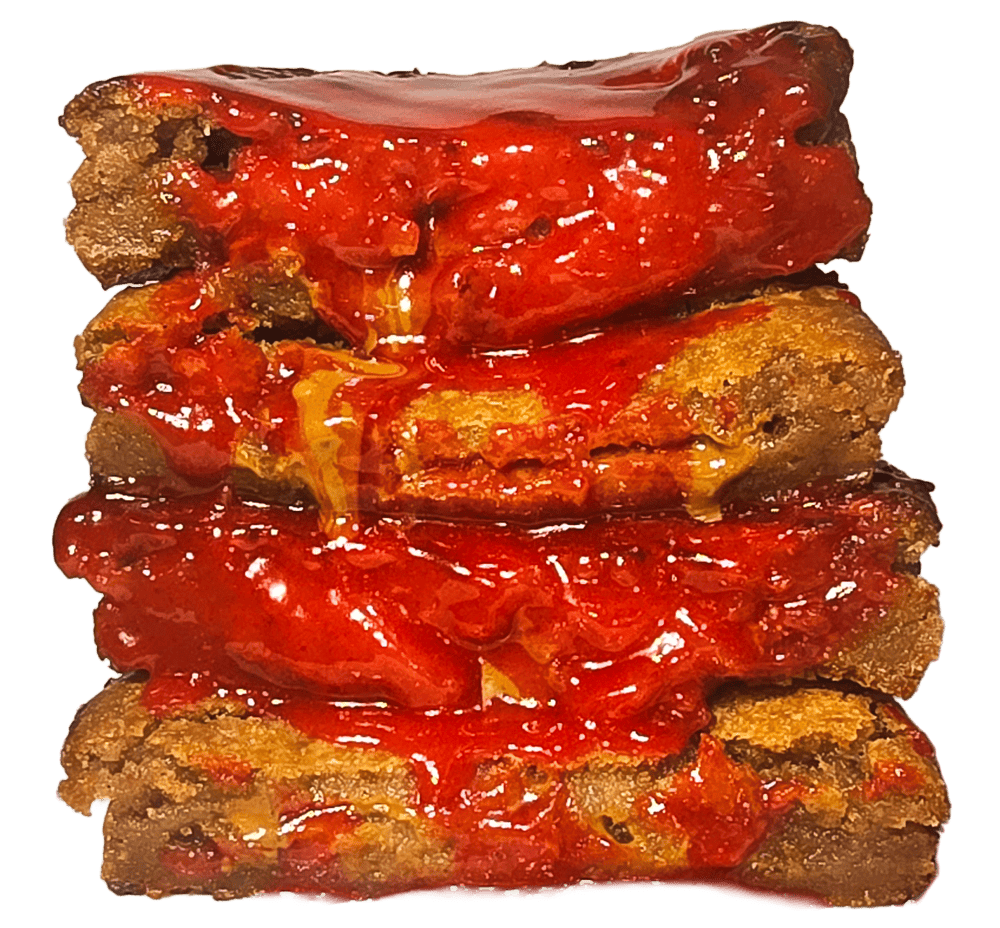 thick stack of cookies that's covered in raspberry topping.