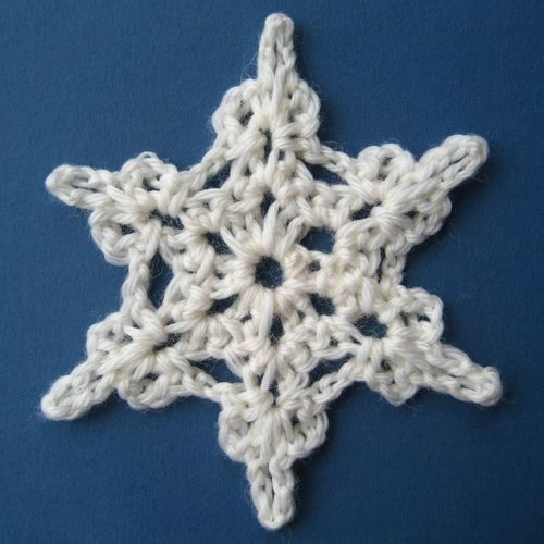 A vintage-style crochet snowflake featuring intricate details that add timeless elegance to winter decor, designed by Attic24.