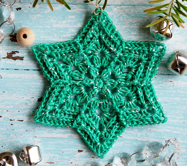 A beautifully unique Flower Star crochet snowflake pattern, blending floral and star shapes for an elegant winter decoration