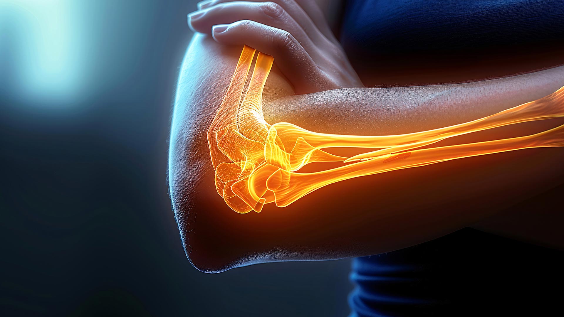 A person crossing their arms with a digital illustration of an orange skeletal structure highlighting the bones of the elbow joint, illustrating areas commonly affected by elbow and wrist pain.