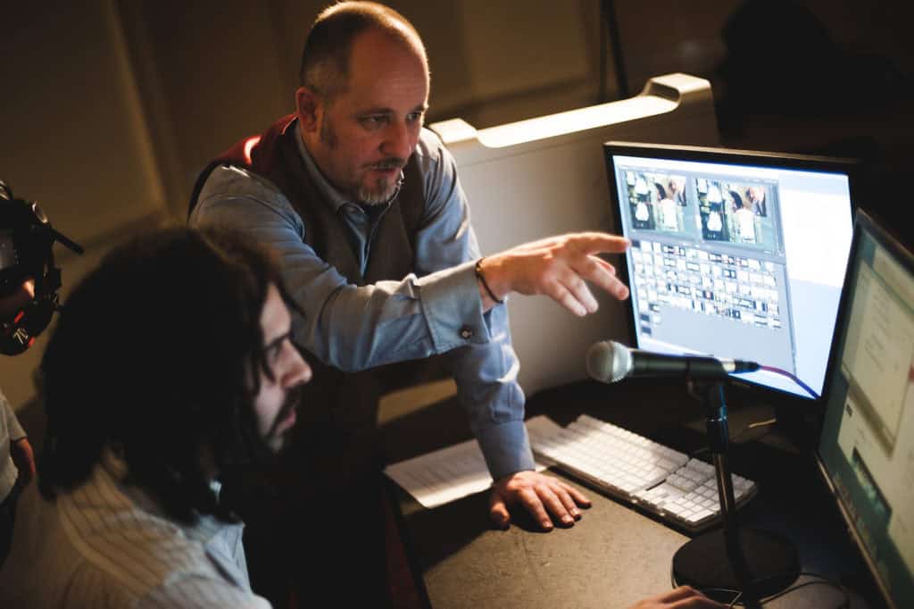 Martin Franklin giving podcast producer input to live streamed transmission