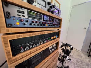 podcast audio production equipment in wooden rack case