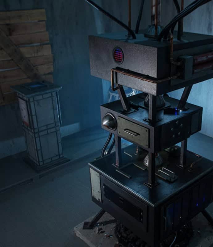 A machine with a large metal base and a large clock.