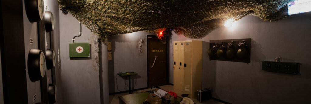 A hallway with a green net over it.