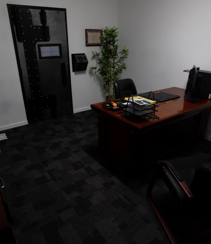 A room with a desk and chair in it.