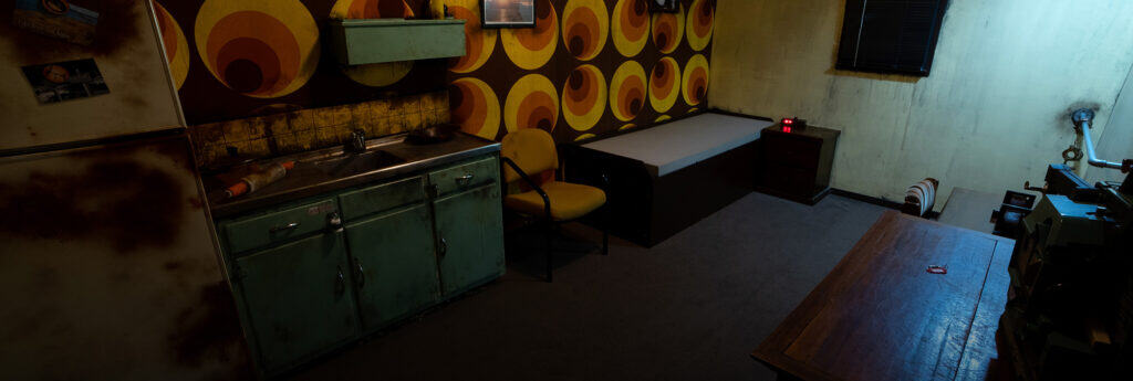A kitchen with a sink, stove and refrigerator.