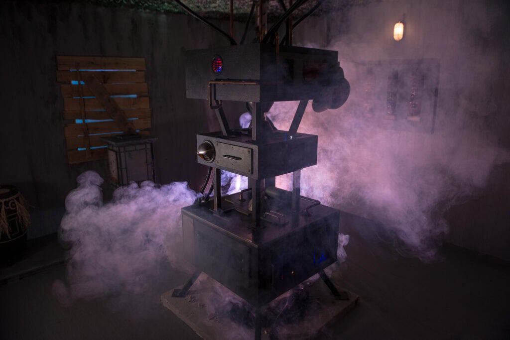 A machine with a clock and a clock face.