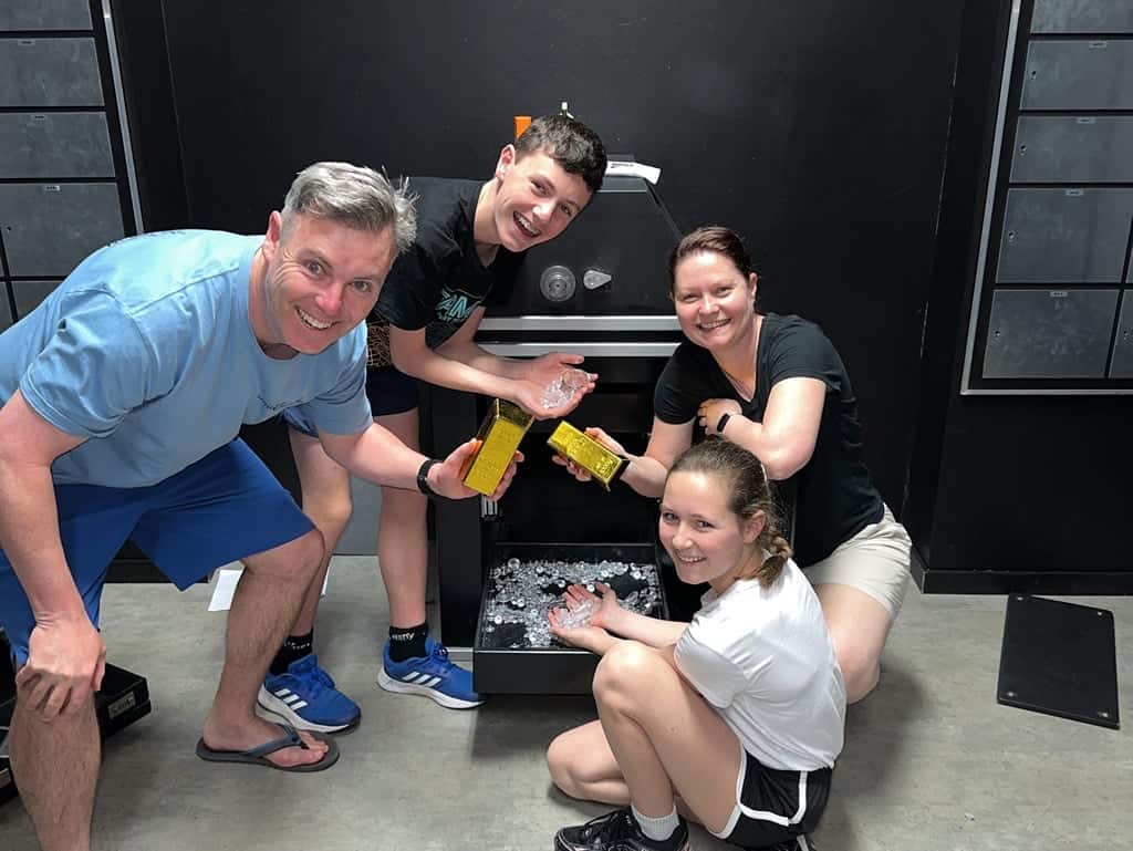 A family of four revealing the diamonds in the Fox in a Box Adelaide -  Mastermind Heist
