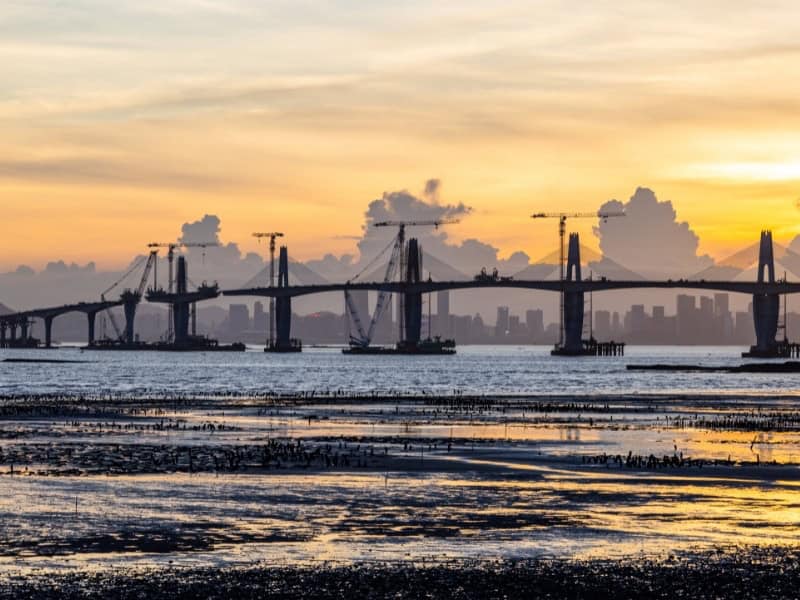 Kinmen bridge at sunset, with skyscrapers of Xiamen in background