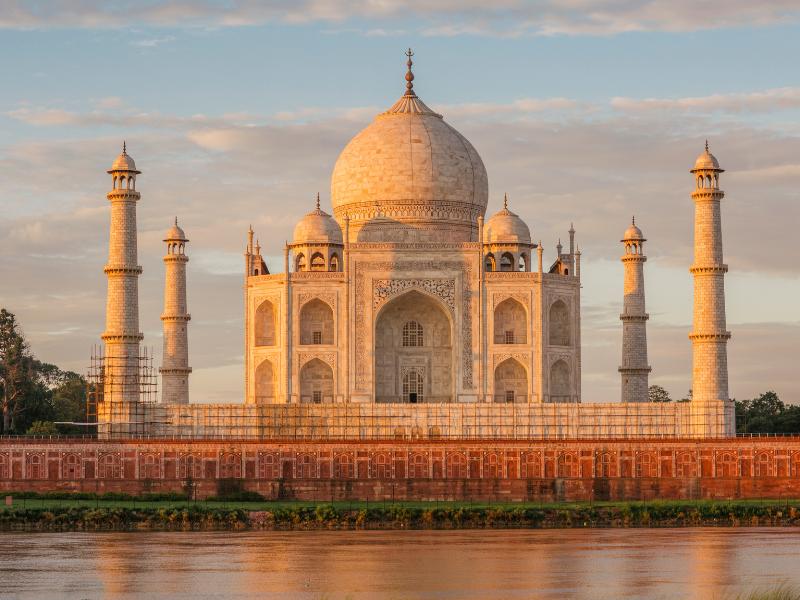 A morning view of the Taj Mahal's iconic facade with its four minarets