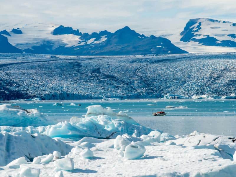 Vatnajökull glacier in Iceland with blue ice formations and mountain backdrop