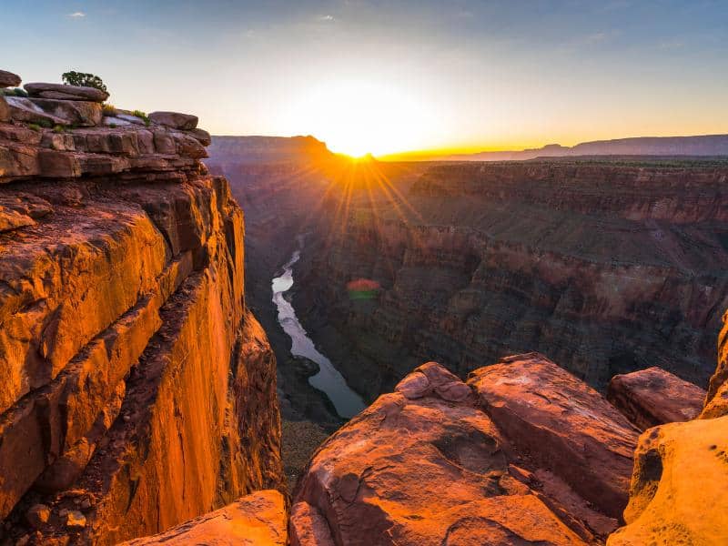 Sunrise over the Grand Canyon National Park in Arizona highlighting steep canyon cliffs