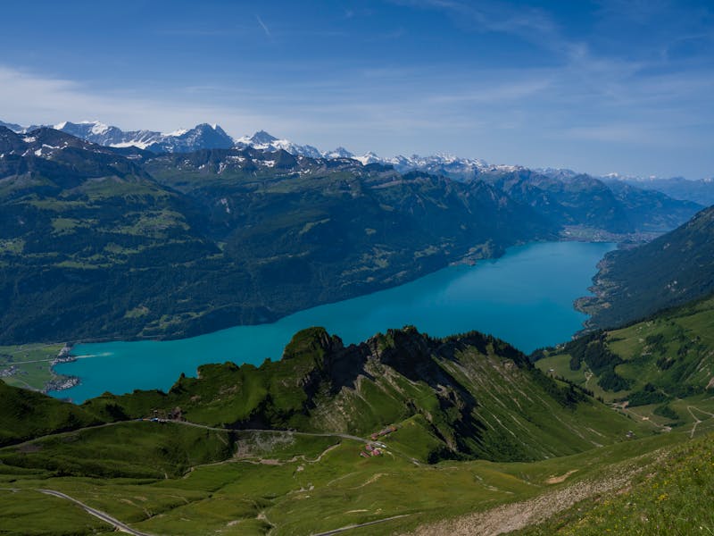 A breathtaking aerial view of Lake Brienz surrounded by the stunning Swiss Alps in summer.