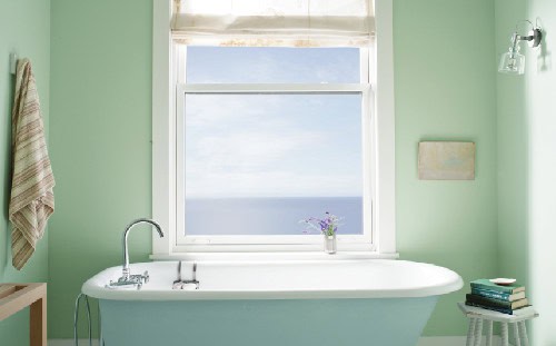 aura-bath bathtub in front of walls painted green colour