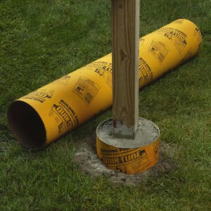 quikrete quicktube building form in ground with one laying beside it