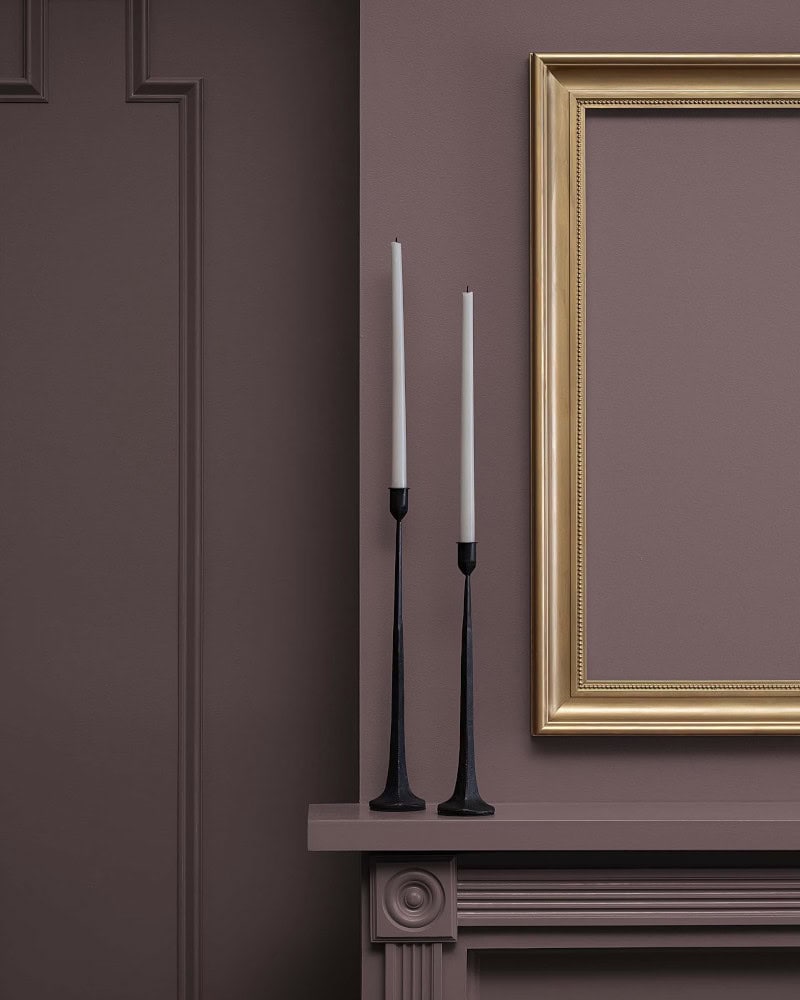 cinnamon-slate-benjamin-moore-painted-wall wall and mantle painted in benjamin moore cinnamon slate with two white candles on mantle