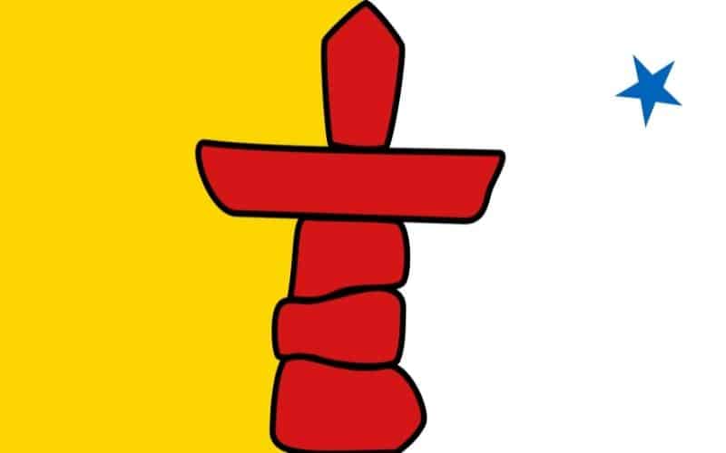 The Nunavut flag, which features a red inukshuk