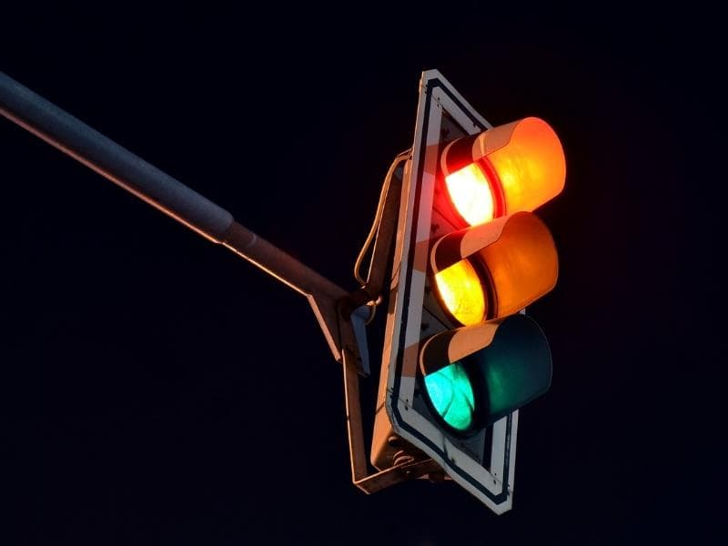 A close up of a traffic light at night